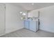 Laundry room featuring a washer and dryer, cabinets, and gray tile flooring at 4519 5Th S Ave, St Petersburg, FL 33711