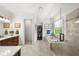 Luxurious bathroom with dual vanities, a walk-in shower, and a soaking tub for ultimate relaxation at 4804 W Beachway Dr, Tampa, FL 33609