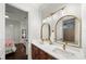 Bright bathroom featuring double sinks, sleek fixtures, and modern lighting at 4804 W Beachway Dr, Tampa, FL 33609
