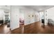 Bright hallway with hardwood floors connecting to the bedrooms and living areas at 4804 W Beachway Dr, Tampa, FL 33609