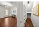 Entryway with hardwood flooring leading to a hallway featuring built-in shelving and closet space at 4804 W Beachway Dr, Tampa, FL 33609
