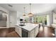 Bright kitchen boasts a center island, stainless steel appliances, and French doors leading to the outdoor area at 4804 W Beachway Dr, Tampa, FL 33609
