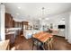 A spacious kitchen with a center island, stainless appliances, adjacent to the dining area and living room at 4804 W Beachway Dr, Tampa, FL 33609
