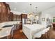 This spacious kitchen features a center island with seating, stainless appliances, and dark-stained hardwood floors at 4804 W Beachway Dr, Tampa, FL 33609