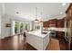 The kitchen has a center island, stainless steel appliances, and doors that open to the outdoor space at 4804 W Beachway Dr, Tampa, FL 33609