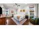 Comfortable main bedroom with natural light, hardwood floors, and neutral decor at 4804 W Beachway Dr, Tampa, FL 33609