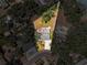 Aerial shot of the property highlighting its unique shape, landscaping, and surrounding neighborhood at 505 S Larry Cir, Brandon, FL 33511