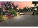 Charming single-story home with a long driveway, well-manicured landscaping, and inviting curb appeal at dusk at 505 S Larry Cir, Brandon, FL 33511
