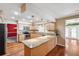 Open concept kitchen featuring wood cabinets, granite counters, and stainless steel appliances at 505 S Larry Cir, Brandon, FL 33511