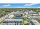 Aerial view of the community showcasing ponds, lush landscaping, and ample parking at 5316 Ladywell Ct, Tampa, FL 33624