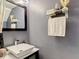Chic powder room features floating vanity, chrome faucet, and modern towel storage at 5316 Ladywell Ct, Tampa, FL 33624