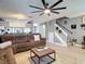 Bright living room with modern furniture, stylish decor, and open access to the kitchen area for easy entertaining at 5316 Ladywell Ct, Tampa, FL 33624