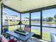 Screened patio featuring pond views, outdoor dining, and comfortable seating at 5316 Ladywell Ct, Tampa, FL 33624