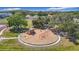 Community playground featuring colorful play structures, swings, and a soft landing surface for children at 5316 Ladywell Ct, Tampa, FL 33624