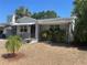 Charming single-story home featuring a landscaped front yard and covered entryway, creating a welcoming curb appeal at 5725 2Nd N Ave, St Petersburg, FL 33710