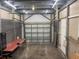 Spacious garage with a new white door, ideal for storage or workshop, offering practical functionality at 5725 2Nd N Ave, St Petersburg, FL 33710