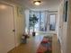Bright hallway with tiled floors, filled with sunlight through many windows, and adorned with tasteful décor at 5725 2Nd N Ave, St Petersburg, FL 33710