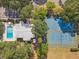 Overhead view of the community amenities, including the pool, tennis courts, and basketball court at 614 Sandalwood Dr, Plant City, FL 33563