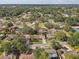 An aerial view displays a well-established neighborhood with tree-lined streets and manicured lawns at 614 Sandalwood Dr, Plant City, FL 33563