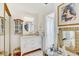 Bright bathroom featuring a vanity with storage and framed mirror at 614 Sandalwood Dr, Plant City, FL 33563