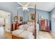 Well-lit bedroom with vaulted ceiling, ceiling fan, and hardwood floors throughout at 614 Sandalwood Dr, Plant City, FL 33563
