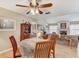 Bright dining area showcasing a ceiling fan, and seamlessly connecting to other living spaces at 614 Sandalwood Dr, Plant City, FL 33563