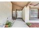 Inviting front entrance with decorative glass door and textured walls leading into this charming home at 614 Sandalwood Dr, Plant City, FL 33563
