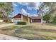 Charming single-Gathering home with a well-manicured front yard and a two-car garage at 614 Sandalwood Dr, Plant City, FL 33563