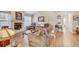 Spacious living room with hardwood floors, a fireplace, and comfortable seating for relaxation at 614 Sandalwood Dr, Plant City, FL 33563