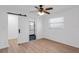 Bedroom with barn door entrance to the ensuite bath and ample natural light at 621 85Th N Ave, St Petersburg, FL 33702