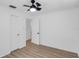 Bright bedroom with ceiling fan, neutral walls and wood-look floors at 621 85Th N Ave, St Petersburg, FL 33702