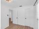 Bright bedroom with stylish ceiling light, neutral walls and wood-look floors at 621 85Th N Ave, St Petersburg, FL 33702