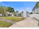 Lovely light blue home with stone chimney, gated entrance, and convenient driveway access at 621 85Th N Ave, St Petersburg, FL 33702