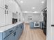 Spacious kitchen with updated appliances, blue lower cabinets, and an open layout at 621 85Th N Ave, St Petersburg, FL 33702