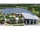 Aerial view of the community clubhouse with a pool and lake view offering residents a place to relax and socialize at 6252 Hidden Branch Dr, Apollo Beach, FL 33572