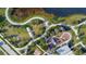 Aerial view of a community park featuring walking paths, playgrounds, and green spaces for outdoor activities at 6252 Hidden Branch Dr, Apollo Beach, FL 33572