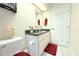 Bright bathroom with white cabinets, granite countertop, and modern fixtures, adjacent to the toilet at 63 Forest Wood Ct, Spring Hill, FL 34609