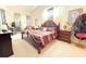 Inviting main bedroom with comfortable bed, wood furniture, and natural lighting at 63 Forest Wood Ct, Spring Hill, FL 34609