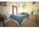 Cozy bedroom features a comfortable bed, soft lighting, and tasteful decor with decorative wall art at 63 Forest Wood Ct, Spring Hill, FL 34609
