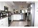 Well-appointed kitchen featuring modern appliances, ample countertop space, and tile flooring at 63 Forest Wood Ct, Spring Hill, FL 34609