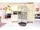 Open kitchen with stainless steel refrigerator, white cabinets, and open layout at 63 Forest Wood Ct, Spring Hill, FL 34609
