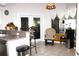 Cozy kitchen featuring a breakfast bar, stainless steel appliances, and bright lighting at 63 Forest Wood Ct, Spring Hill, FL 34609