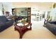 Spacious living room with adjacent kitchen, large TV, and lots of living space at 63 Forest Wood Ct, Spring Hill, FL 34609