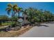 Community entrance sign for Southtown Park with palm trees and lush landscaping along a paved road at 6918 Frog Pocket Pl, Tampa, FL 33616