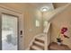 Light-filled entryway with staircase, neutral walls, and modern lighting, creating a welcoming first impression at 6918 Frog Pocket Pl, Tampa, FL 33616
