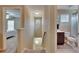 Upstairs hallway connecting bedroom and bathroom spaces at 6918 Frog Pocket Pl, Tampa, FL 33616