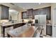 Gourmet kitchen featuring stainless steel appliances, granite counters, ample storage, and an island at 6918 Frog Pocket Pl, Tampa, FL 33616