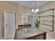 Cozy kitchen nook with a dark wooden table and seating for two at 6918 Frog Pocket Pl, Tampa, FL 33616