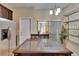 Bright and airy kitchen featuring stainless steel appliances, dark wood cabinets, and a kitchen island at 6918 Frog Pocket Pl, Tampa, FL 33616