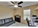 Office featuring a desk and seating with a ceiling fan and natural light at 6918 Frog Pocket Pl, Tampa, FL 33616